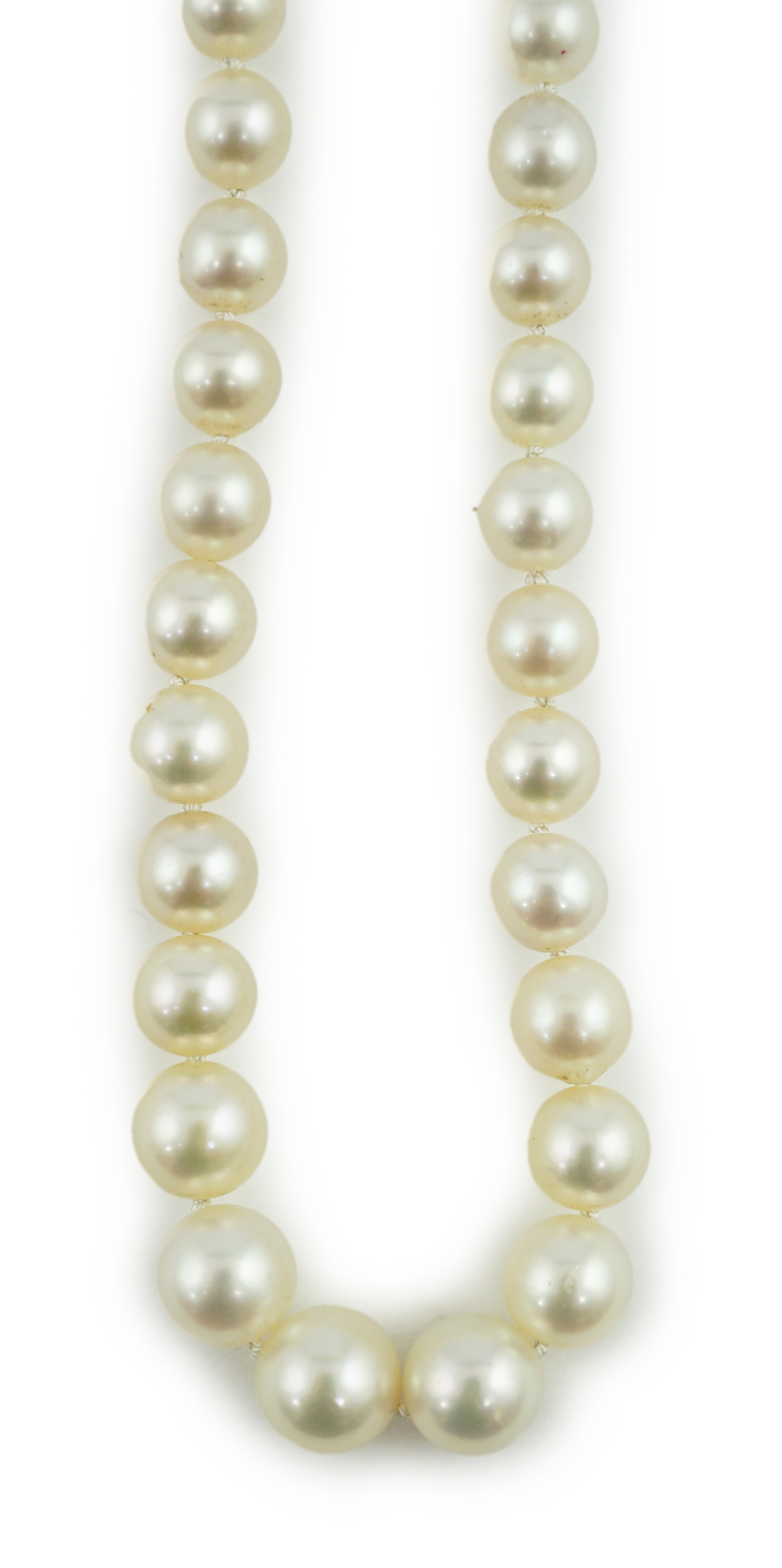 A single strand graduated cultured pearl necklace, with a gold, garnet and rose cut diamond cluster set clasp